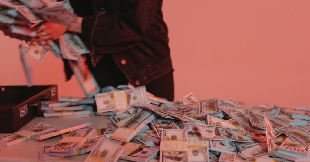 A man grabbing a pile of money