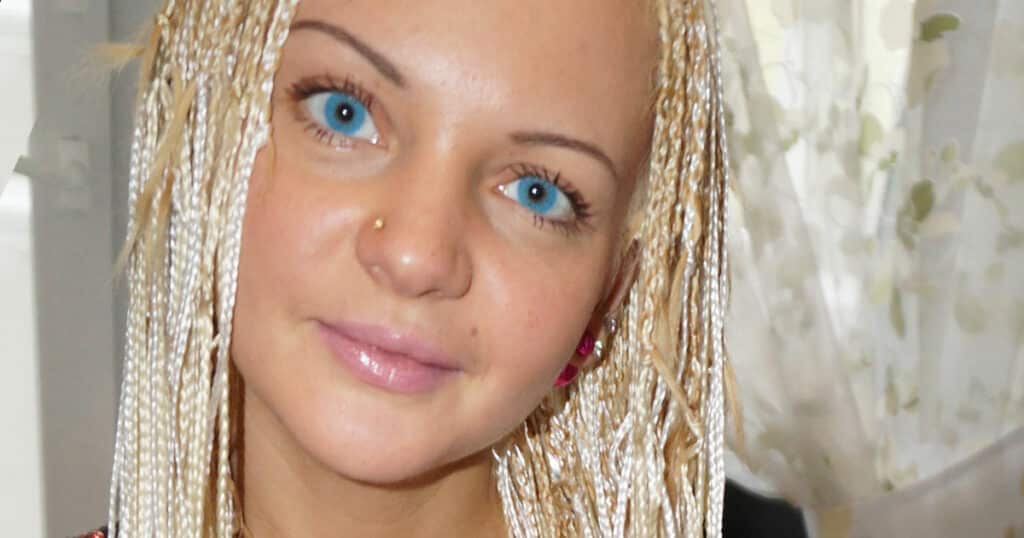 Blue eyes woman with blond hair and braids