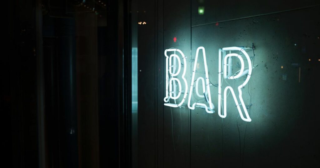 An illuminated bar sign