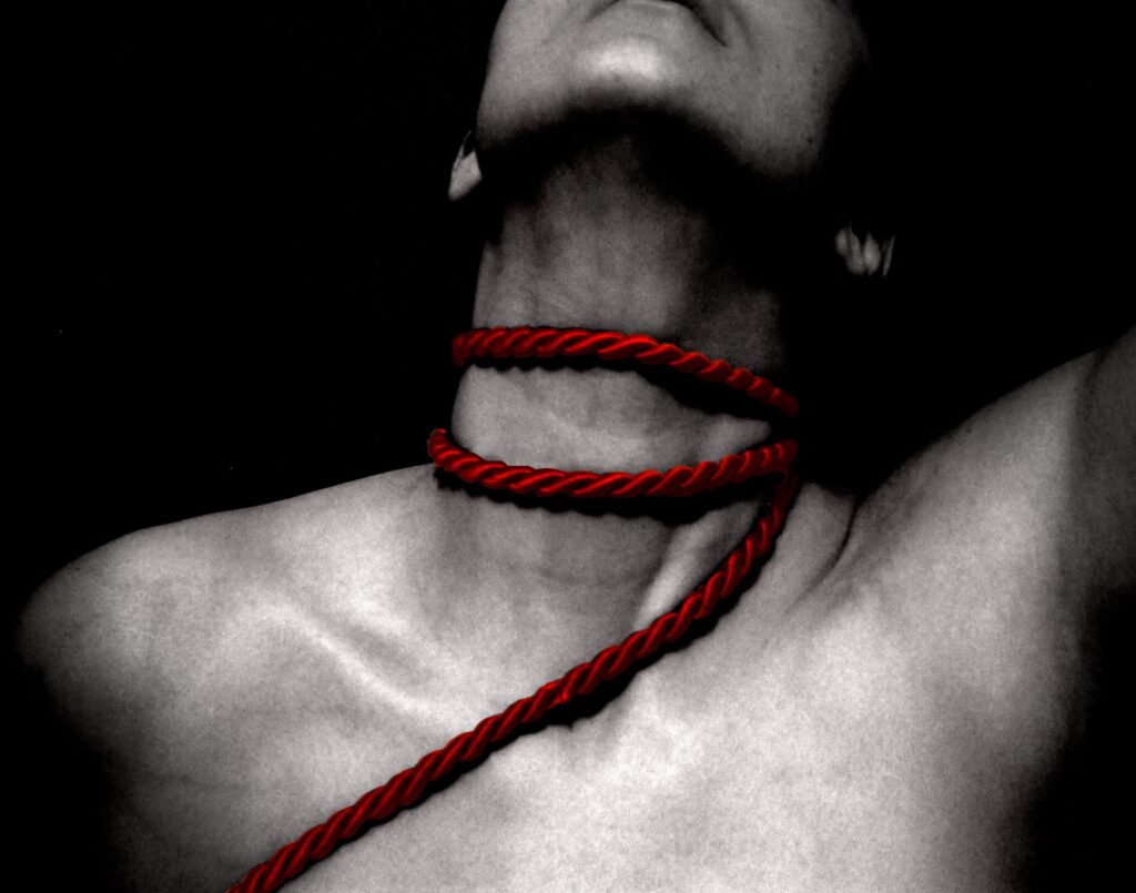 Red rope around the neck